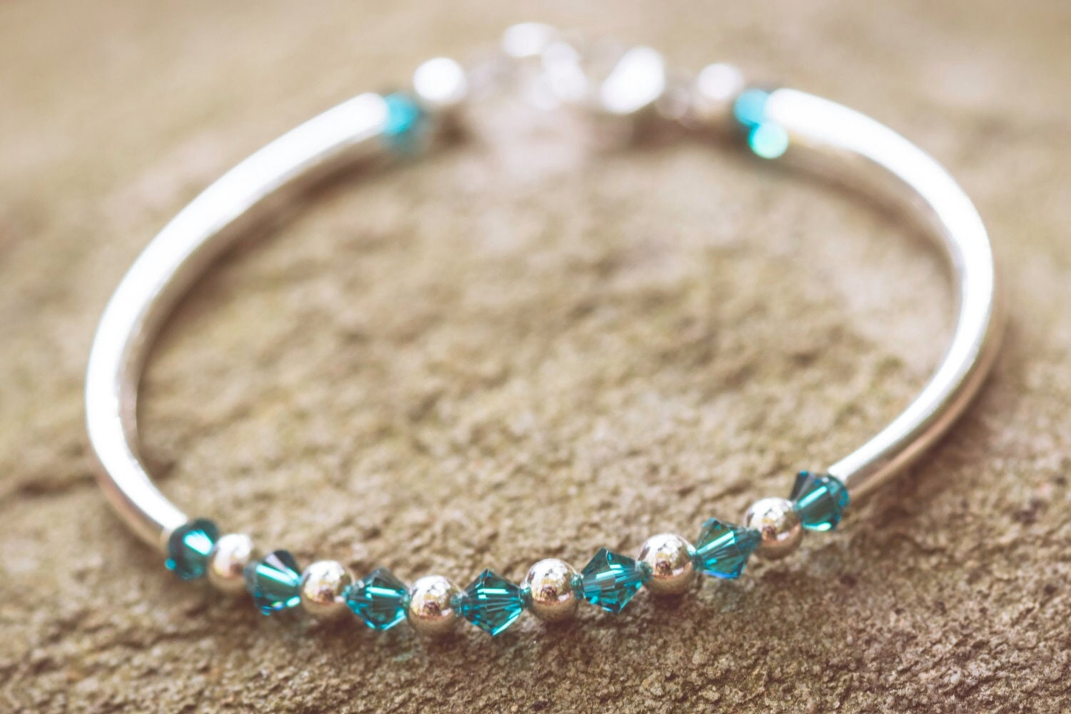 December Blue Zircon Swarovski Crystal Birth Month Sterling Silver Plated Bracelet on stone