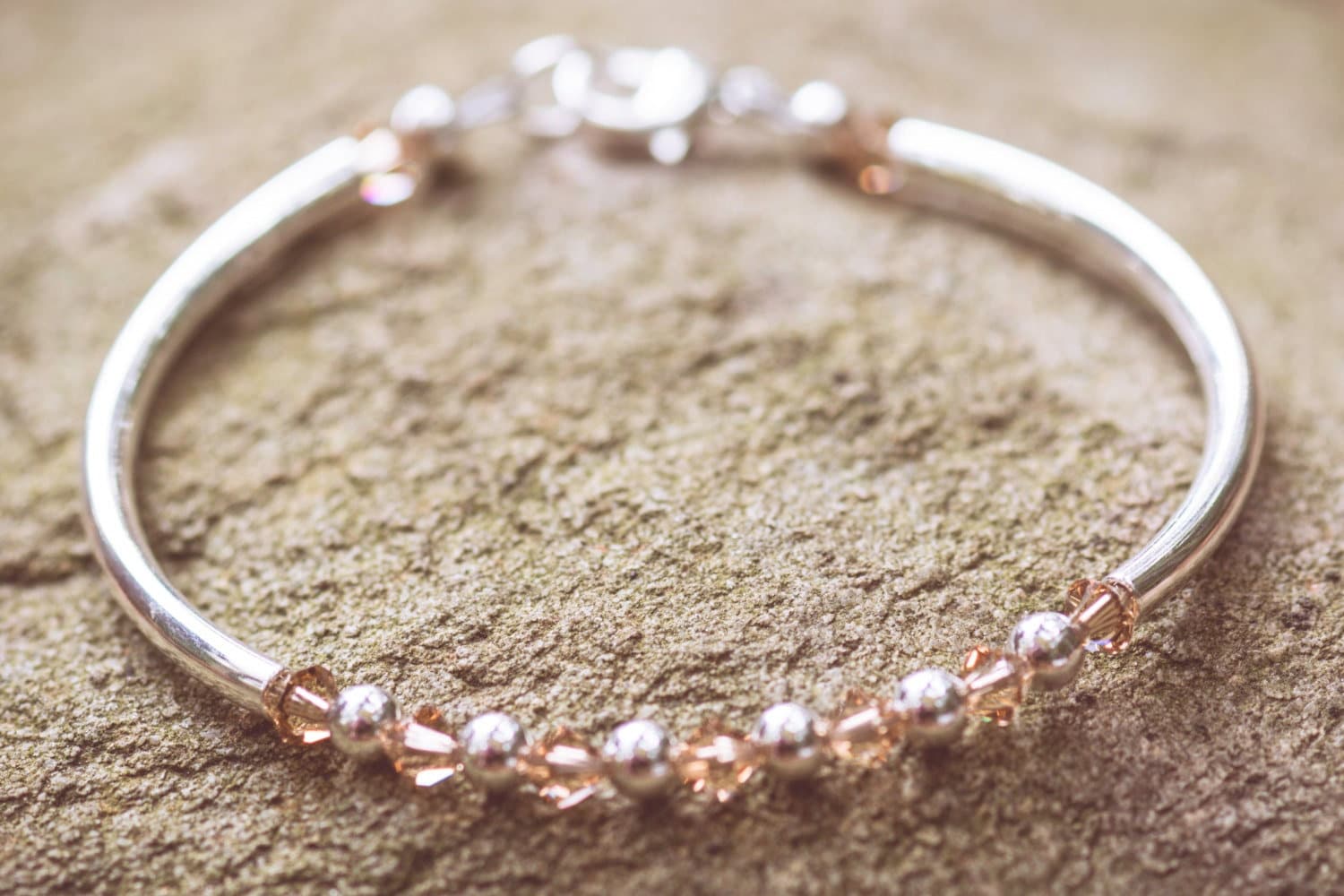 November Topaz Swarovski Crystal Birth Month Sterling Silver Plated Bracelet on stone