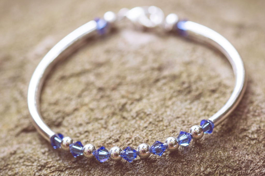 September Sapphire Swarovski Crystal Birth Month Sterling Silver Plated Bracelet on stone
