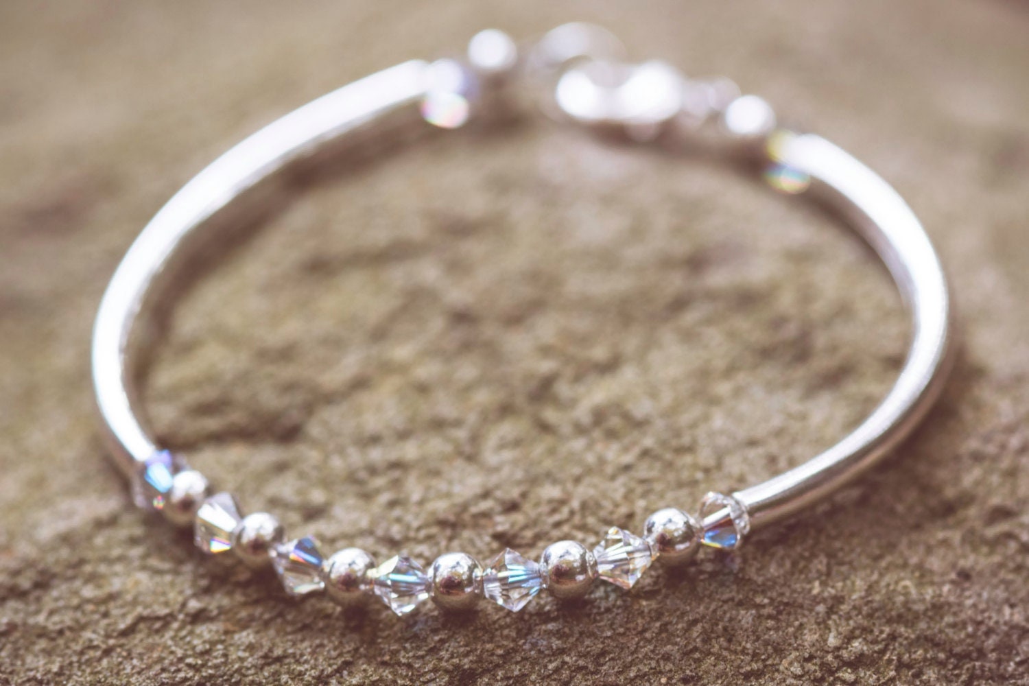 April Diamond Swarovski Crystal Birth Month Sterling Silver Plated Bracelet on stone