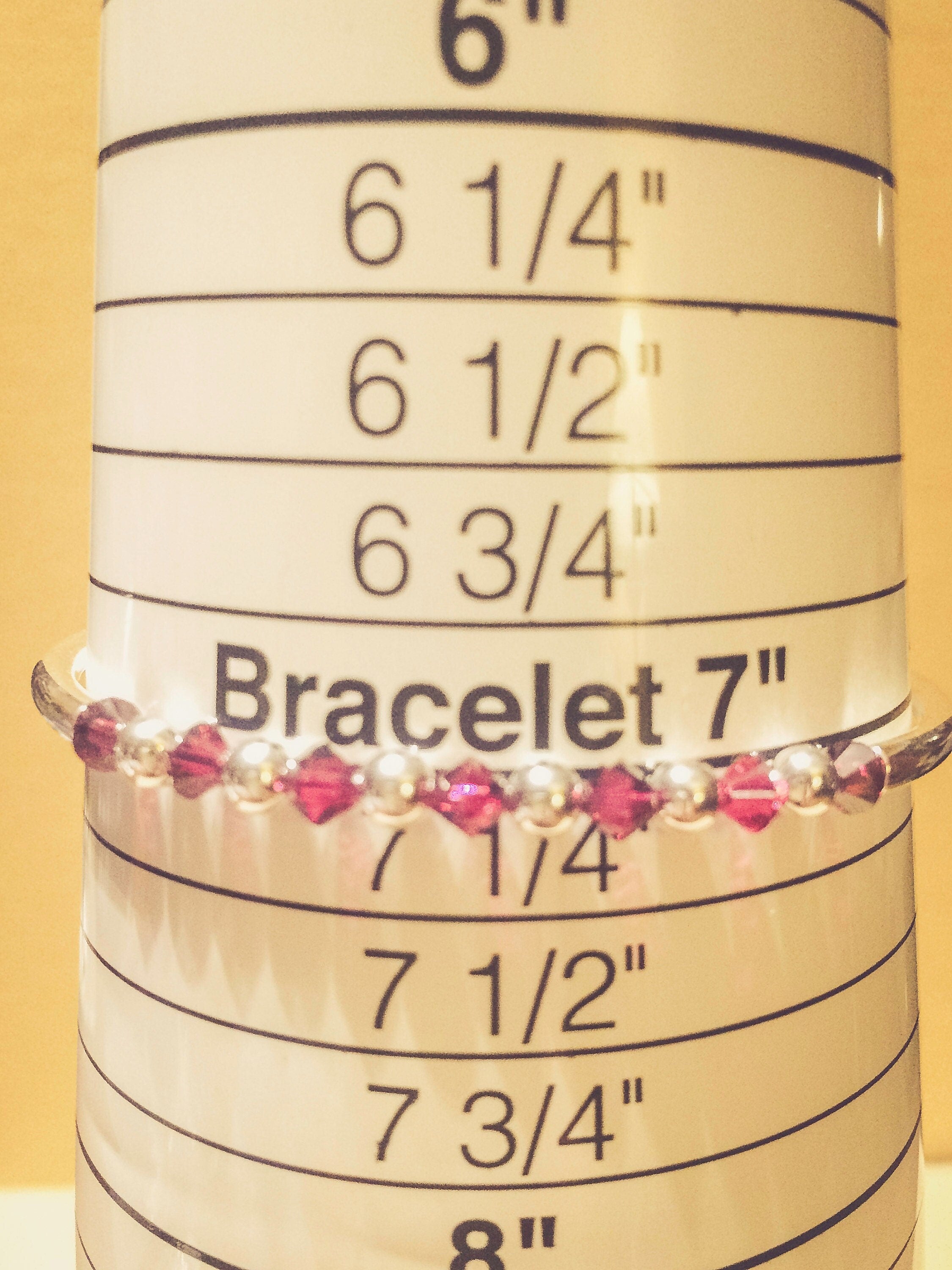 July Ruby Swarovski Crystal Birth Month Sterling Silver Plated Bracelet on bracelet measuring cone