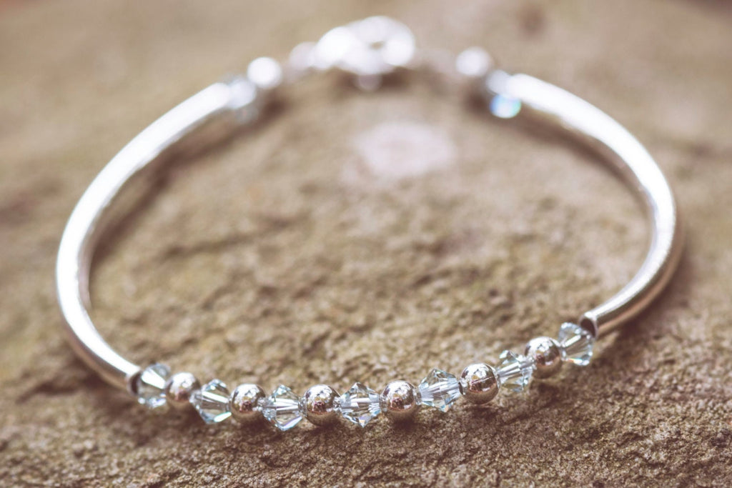 December Light Azore Swarovski Crystal Birth Month Sterling Silver Plated Bracelet on stone