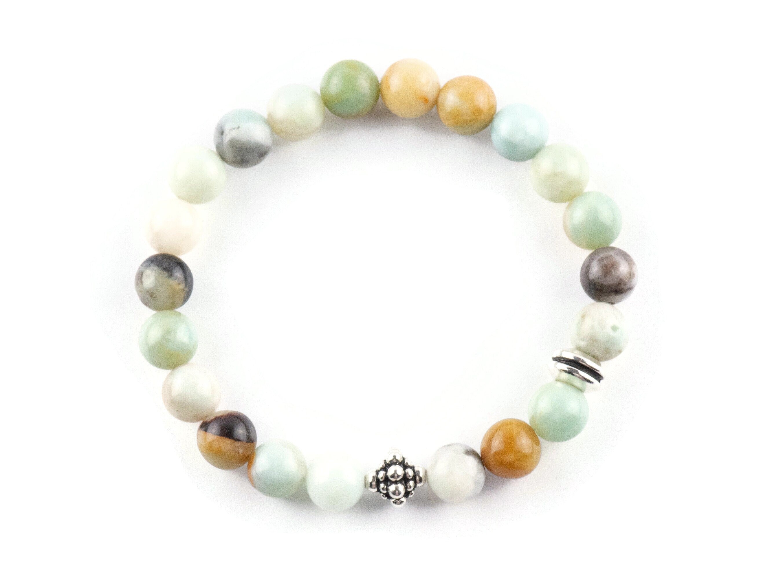 Black Gold Amazonite Genuine Gemstone Stretch Bracelet on white background. Amazonite beads are multicolor earth-tones. Center bead is a silver Bali style bead.