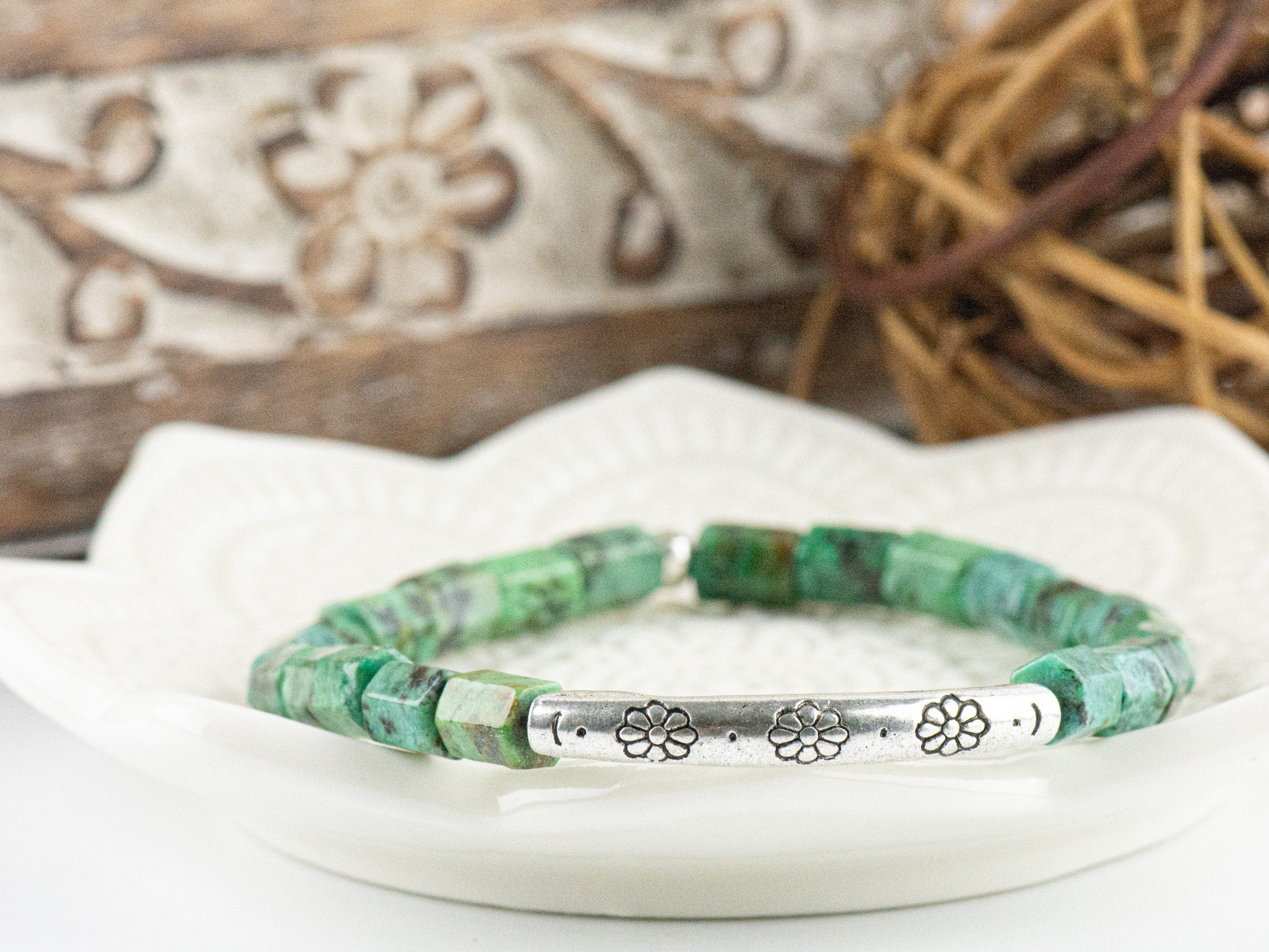 African Turquoise Stretch Bracelet on a white lotus flower shaped tray