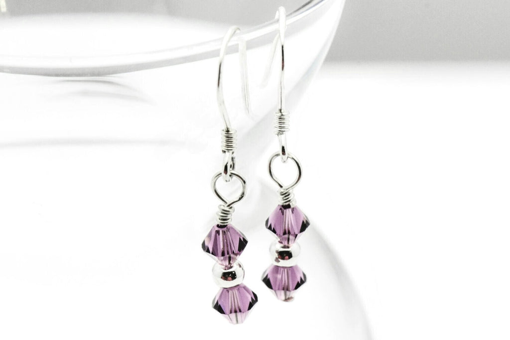 February Amethyst Swarovski Crystal Birth Month Sterling Silver Drop Earrings hanging on vase