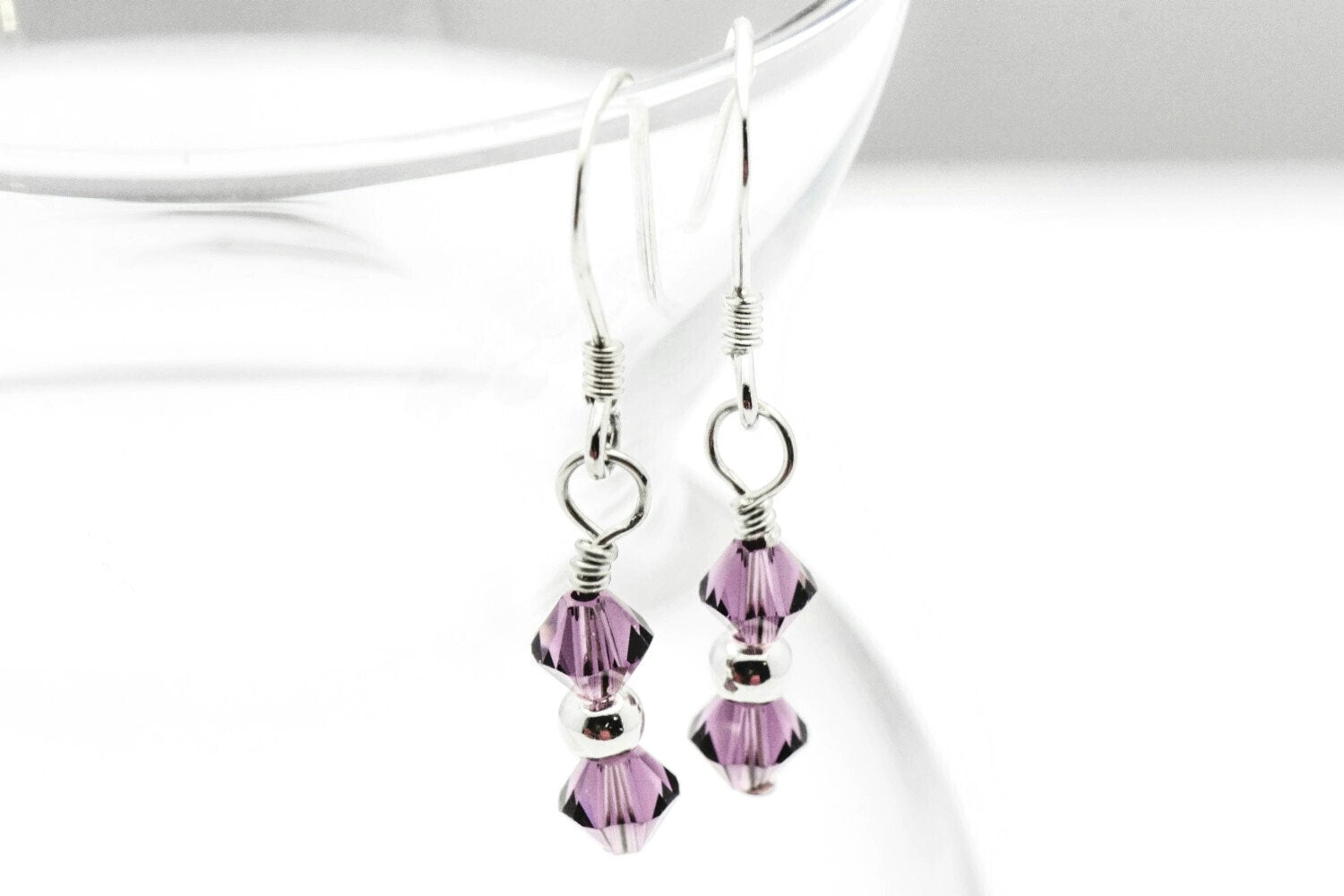 February Amethyst Swarovski Crystal Birth Month Sterling Silver Drop Earrings hanging on vase