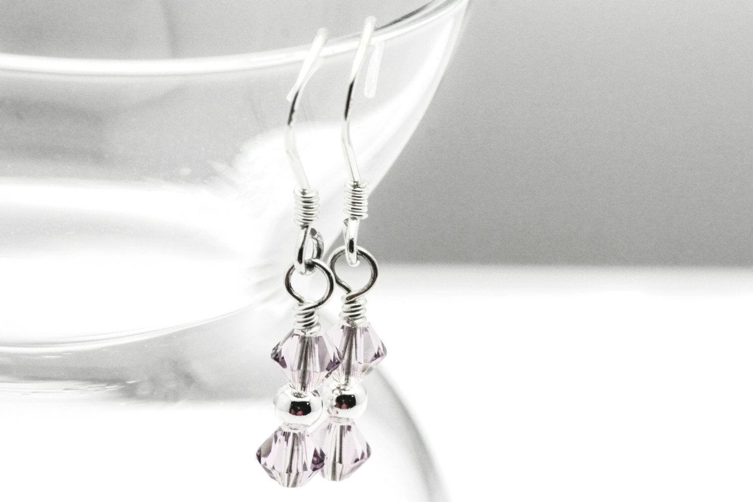 June Alexandrite Swarovski Crystal Birth Month Sterling Silver Drop Earrings hanging on vase