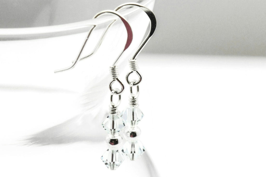 December Light Azore Swarovski Crystal Birth Month Sterling Silver Drop Earrings hanging on vase