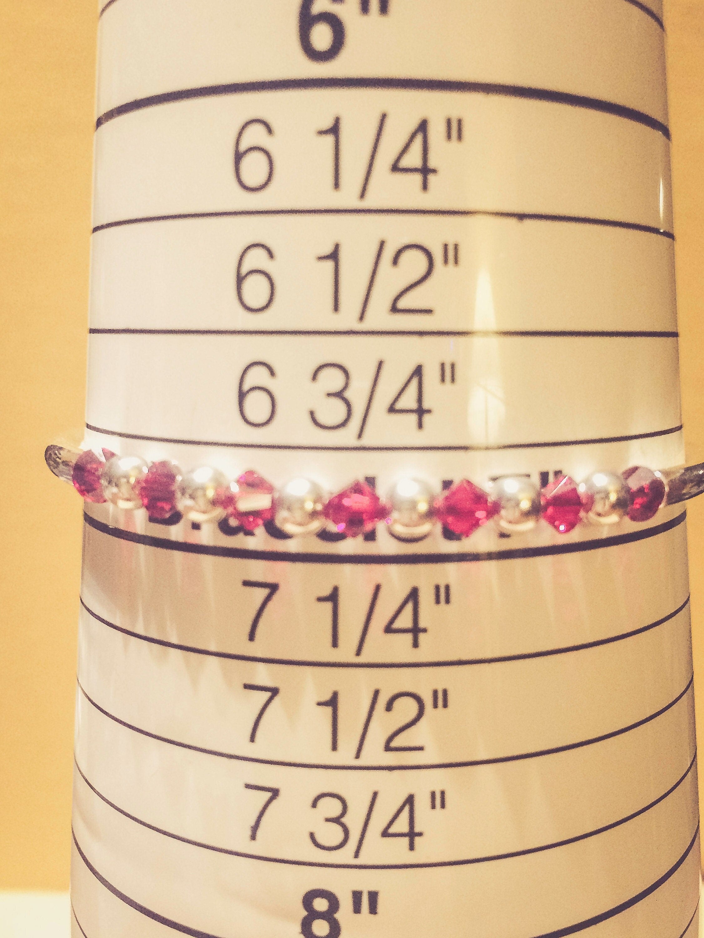 January Garnet Swarovski Crystal Birth Month Sterling Silver Plated Bracelet on bracelet measuring cone