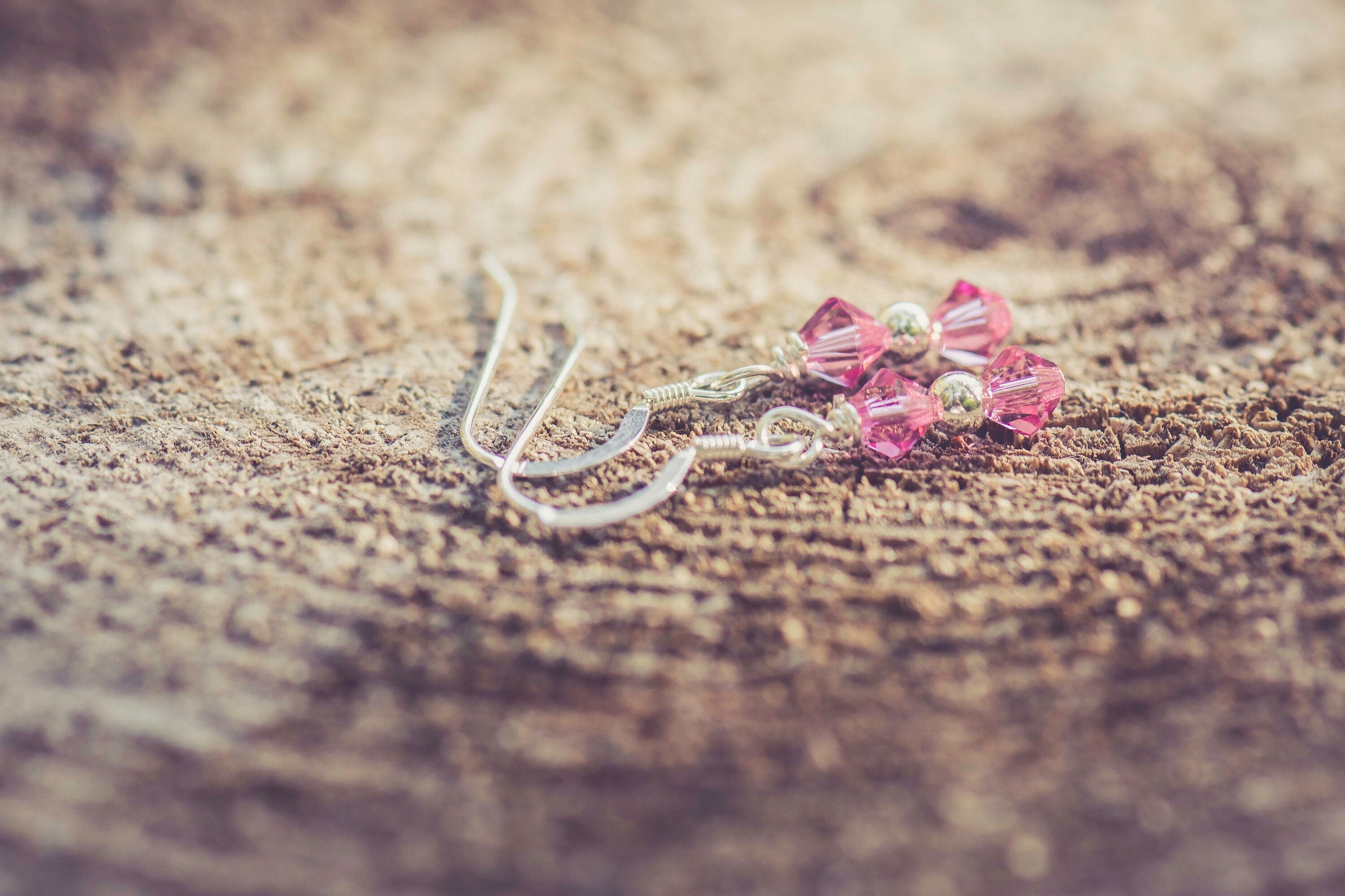 October Rose Swarovski Crystal Birth Month Sterling Silver Drop Earrings on wood background