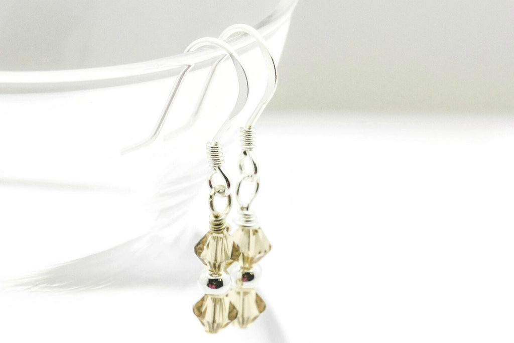 November Topaz Swarovski Crystal Birth Month Sterling Silver Drop Earrings hanging on vase