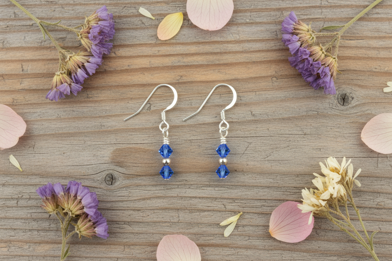 September Sapphire Earrings flat lay